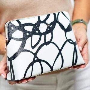 LOUENHIDE Bardot Swirl Case cream black rose gold tone hardware interior lined